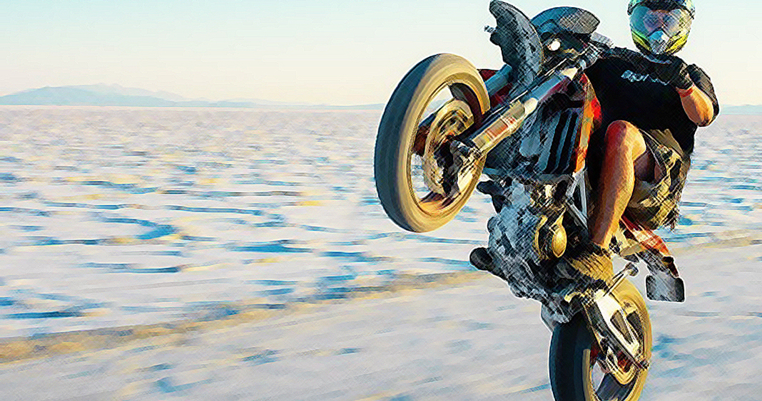 Girl doing clearance wheelie on harley