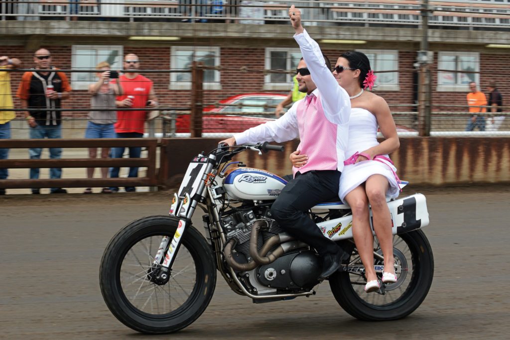 Jared and Nichole Mees ride around the Springfield Mile on the Harley-Davidson XR750