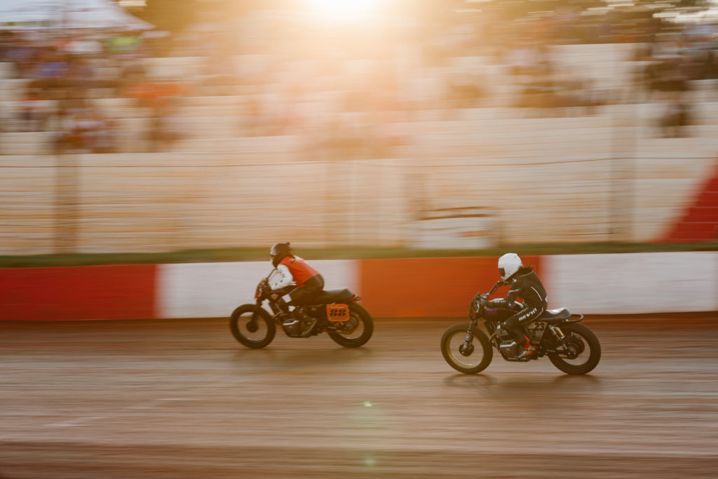 The ladies of Royal Enfield's Build Train Race program at speed on the Atlanta Short Track